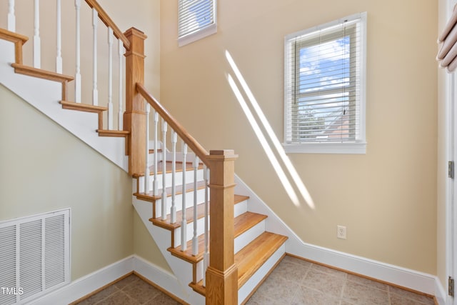 207 N Hopkins Ave, Spring Hope, NC 27882 - staircase featuring baseboards and tile patterned flooring