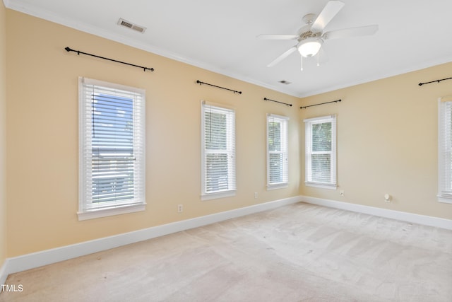 207 N Hopkins Ave, Spring Hope, NC 27882 - unfurnished room featuring ornamental molding, baseboards, light colored carpet, and a ceiling fan