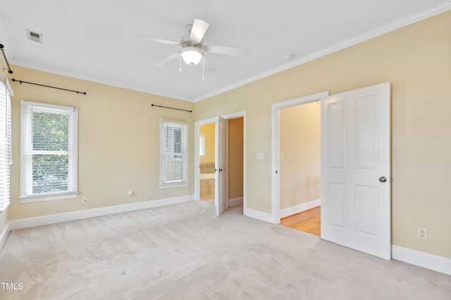 207 N Hopkins Ave, Spring Hope, NC 27882 - unfurnished bedroom featuring carpet, ornamental molding, baseboards, and ceiling fan