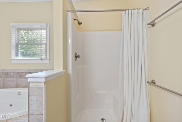 207 N Hopkins Ave, Spring Hope, NC 27882 - full bathroom featuring curtained shower and a tub with jets