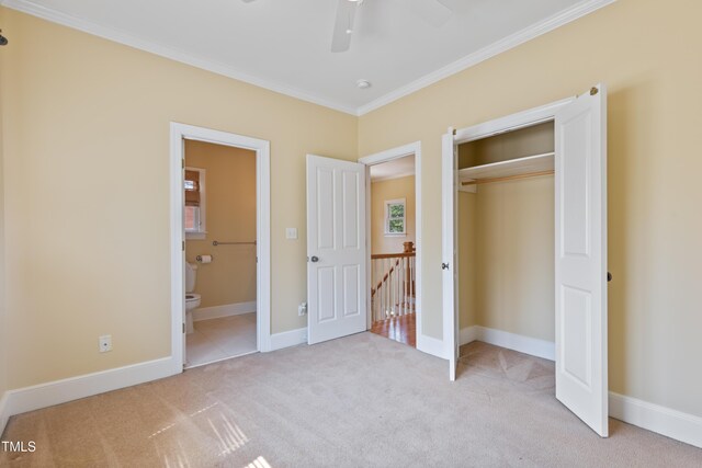 207 N Hopkins Ave, Spring Hope, NC 27882 - unfurnished bedroom with carpet, ornamental molding, a closet, ensuite bathroom, and baseboards