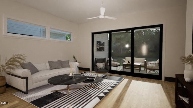 living room featuring wood finished floors, a ceiling fan, and baseboards