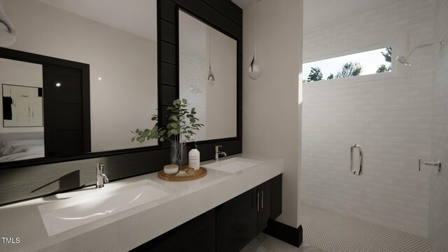 bathroom featuring a stall shower and double vanity