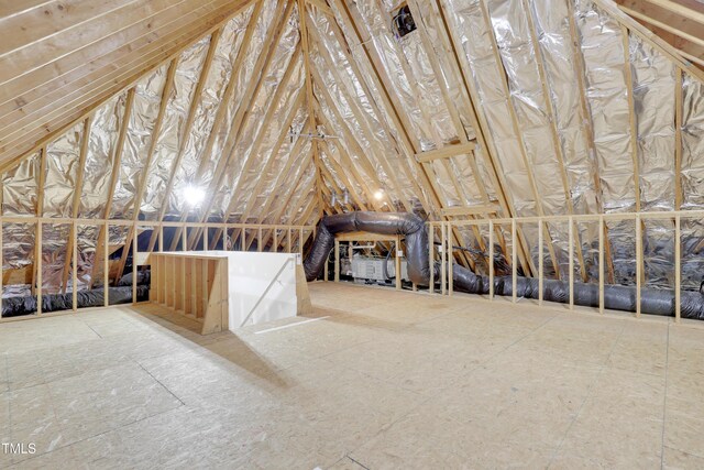 unfinished attic featuring an upstairs landing