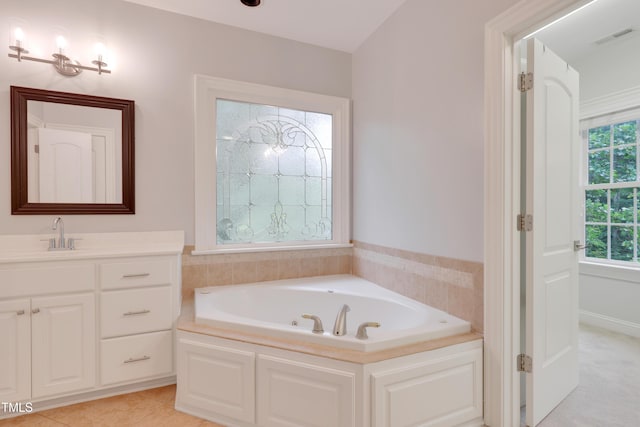 full bathroom with a bath and vanity