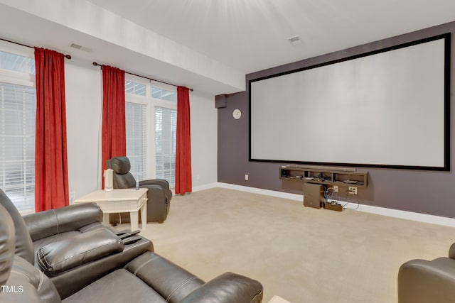 home theater room featuring carpet and baseboards