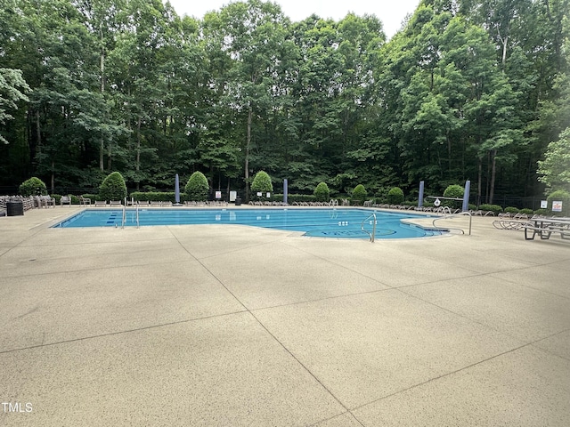 community pool featuring a patio