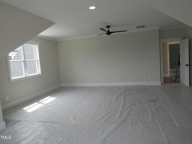 empty room with crown molding, ceiling fan, baseboards, and recessed lighting