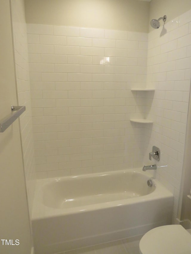bathroom featuring toilet and tile patterned floors