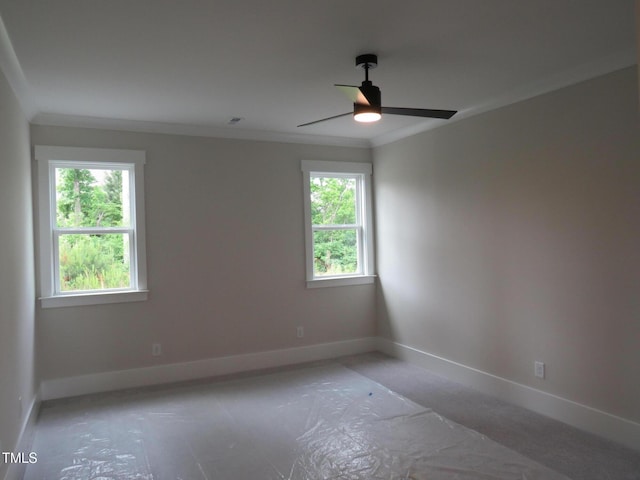 empty room with baseboards, a ceiling fan, and ornamental molding