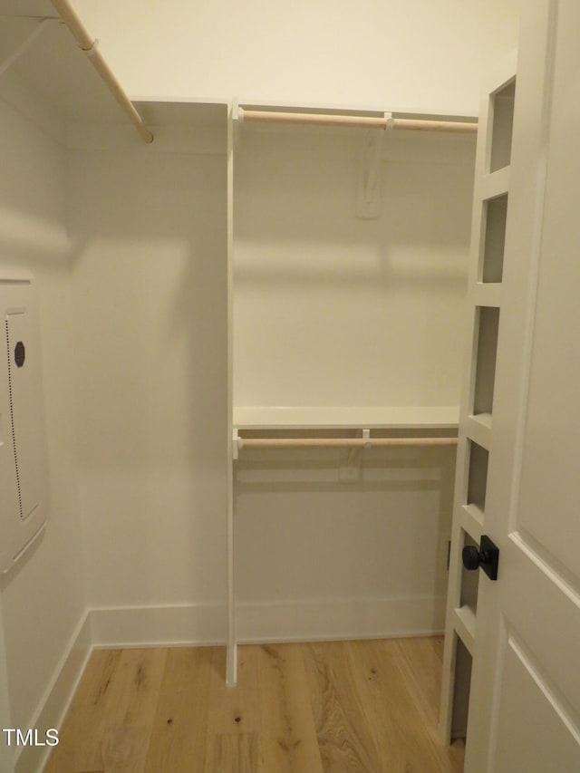 spacious closet featuring light wood-style floors