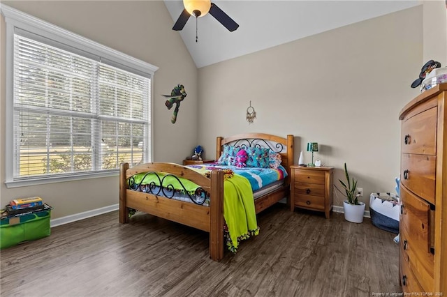 bedroom featuring lofted ceiling, wood finished floors, baseboards, and ceiling fan