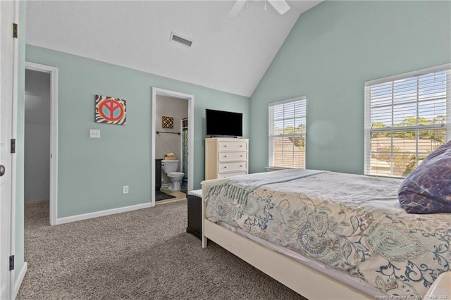 carpeted bedroom featuring baseboards, high vaulted ceiling, connected bathroom, and ceiling fan