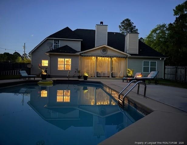 view of pool with a patio area and a fenced backyard