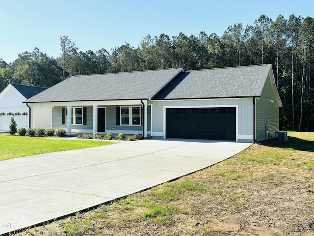 121 Earnest Way, Kenly, NC 27542 - ranch-style house featuring an attached garage, a front yard, concrete driveway, a shingled roof, and central AC