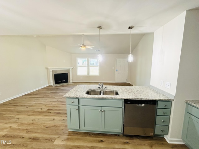 121 Earnest Way, Kenly, NC 27542 - kitchen featuring a sink, dishwasher, vaulted ceiling, green cabinets, and light wood finished floors