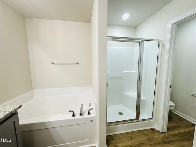 121 Earnest Way, Kenly, NC 27542 - bathroom featuring a shower stall, wood finished floors, a bath, and toilet