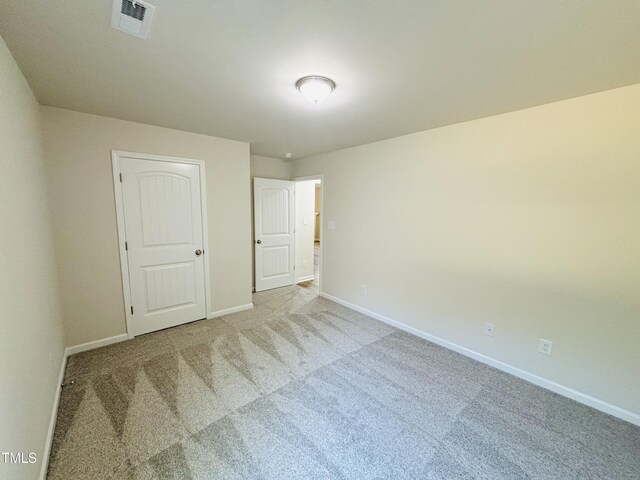 121 Earnest Way, Kenly, NC 27542 - unfurnished bedroom featuring carpet flooring and baseboards