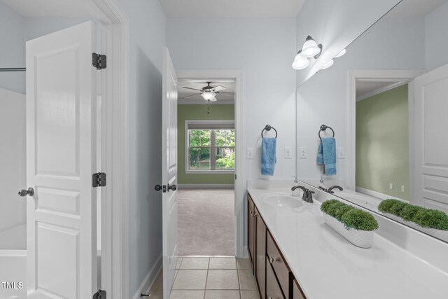 bathroom with vanity, a ceiling fan, tile patterned floors, and baseboards