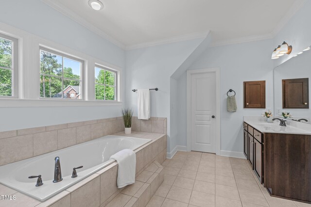 bathroom with crown molding, a bath, vanity, tile patterned floors, and baseboards