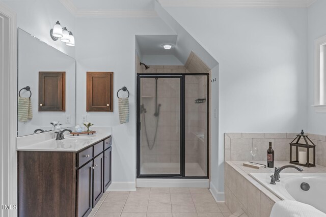 bathroom featuring a shower stall, tile patterned flooring, a bath, vanity, and baseboards