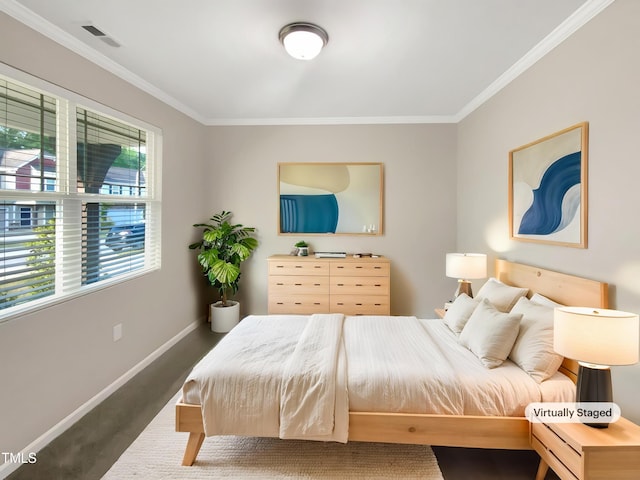 bedroom featuring crown molding and baseboards