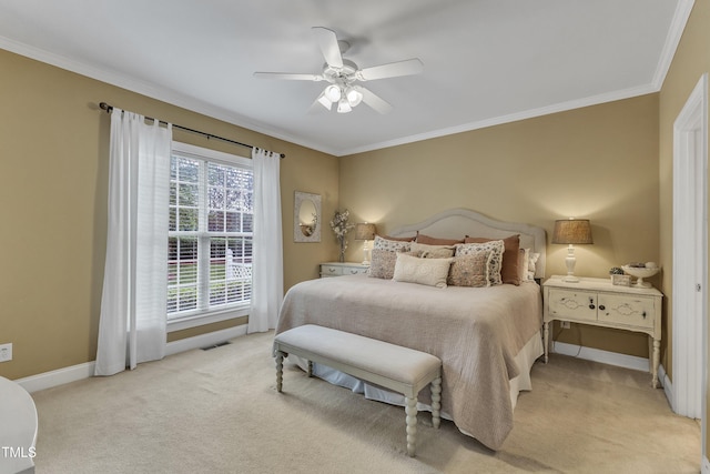 carpeted bedroom featuring crown molding, baseboards, and ceiling fan