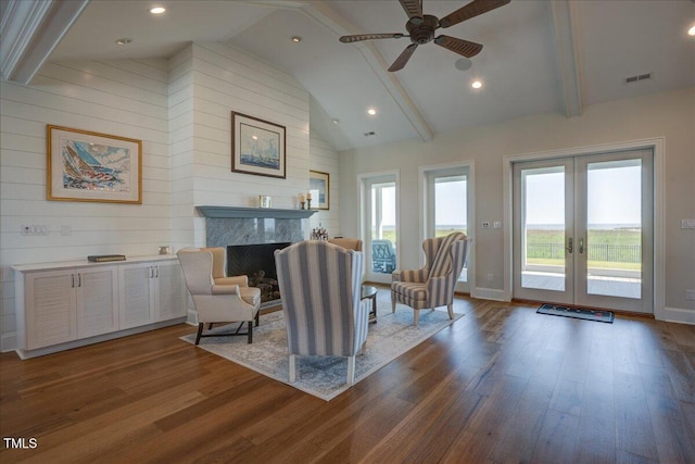 76 Soundside Dr, Oriental, NC 28571 - living area with dark wood-style flooring, ceiling fan, beamed ceiling, a premium fireplace, and french doors