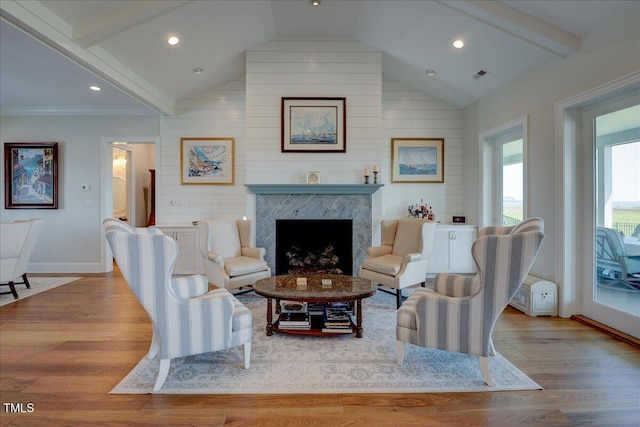 76 Soundside Dr, Oriental, NC 28571 - living room featuring wood finished floors, baseboards, a high end fireplace, recessed lighting, and wooden walls
