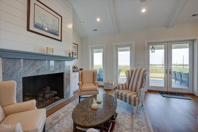 76 Soundside Dr, Oriental, NC 28571 - living area featuring wood finished floors, french doors, recessed lighting, and a fireplace