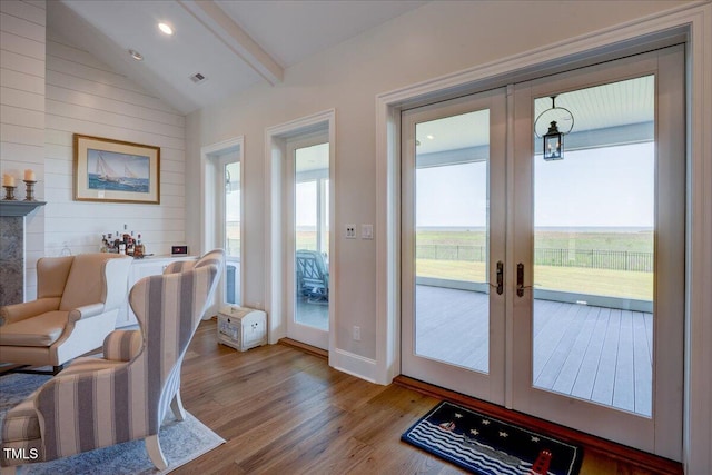76 Soundside Dr, Oriental, NC 28571 - doorway to outside with vaulted ceiling, wood finished floors, french doors, and wood walls