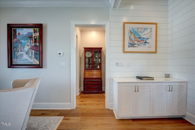 76 Soundside Dr, Oriental, NC 28571 - hallway with light wood-style floors, wood walls, baseboards, and ornamental molding