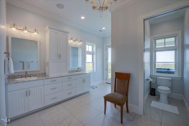 76 Soundside Dr, Oriental, NC 28571 - bathroom featuring double vanity, baseboards, crown molding, toilet, and tile patterned flooring