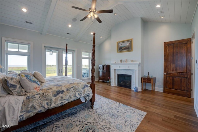 76 Soundside Dr, Oriental, NC 28571 - bedroom with access to exterior, wood finished floors, multiple windows, recessed lighting, and wood ceiling with exposed beams