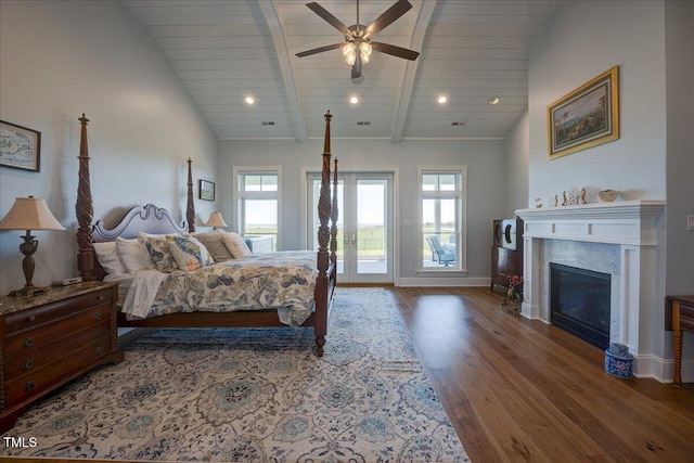 76 Soundside Dr, Oriental, NC 28571 - bedroom with multiple windows, baseboards, wood finished floors, access to exterior, and recessed lighting