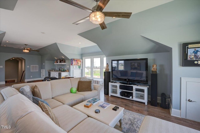 76 Soundside Dr, Oriental, NC 28571 - living area featuring a ceiling fan, a bar, baseboards, wood finished floors, and arched walkways