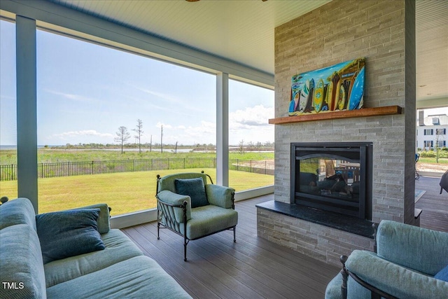 76 Soundside Dr, Oriental, NC 28571 - living room with a multi sided fireplace, wood finished floors, and a view of rural / pastoral area