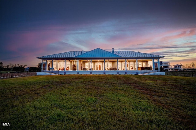 76 Soundside Dr, Oriental, NC 28571 - back of house at dusk featuring a standing seam roof and metal roof
