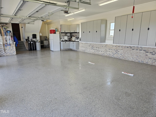 76 Soundside Dr, Oriental, NC 28571 - garage with freestanding refrigerator and a garage door opener