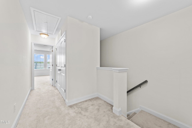 149 E Porthaven Way, Clayton, NC 27527 - corridor featuring attic access, baseboards, carpet flooring, and an upstairs landing