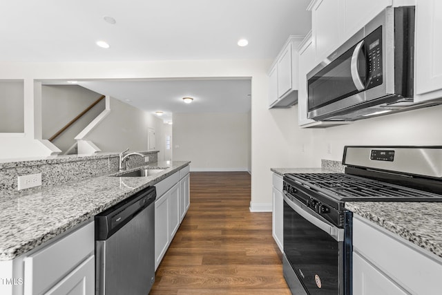 149 E Porthaven Way, Clayton, NC 27527 - kitchen featuring white cabinets, stainless steel appliances, light stone countertops, and a sink