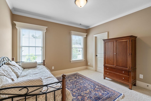 bedroom featuring light carpet, crown molding, and baseboards