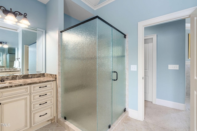 bathroom featuring a stall shower, vanity, tile patterned flooring, and baseboards