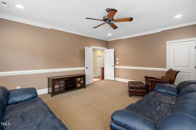 carpeted living area with ceiling fan, baseboards, ornamental molding, and recessed lighting
