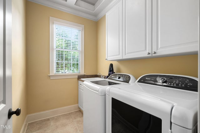 clothes washing area featuring independent washer and dryer, baseboards, crown molding, cabinet space, and light tile patterned flooring