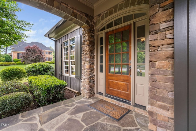 view of exterior entry with stone siding