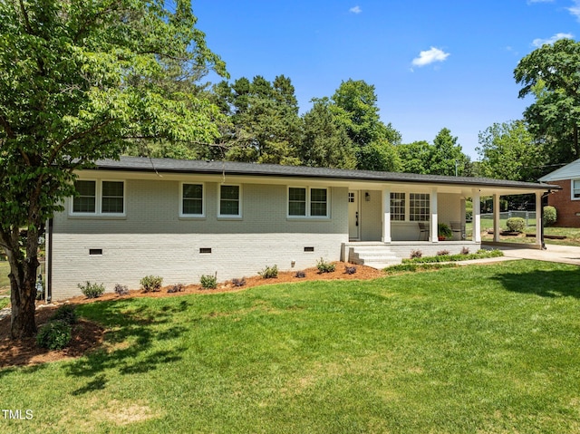 5208 Melbourne Rd, Raleigh, NC 27606 - ranch-style house with crawl space, brick siding, a front yard, a porch, and driveway