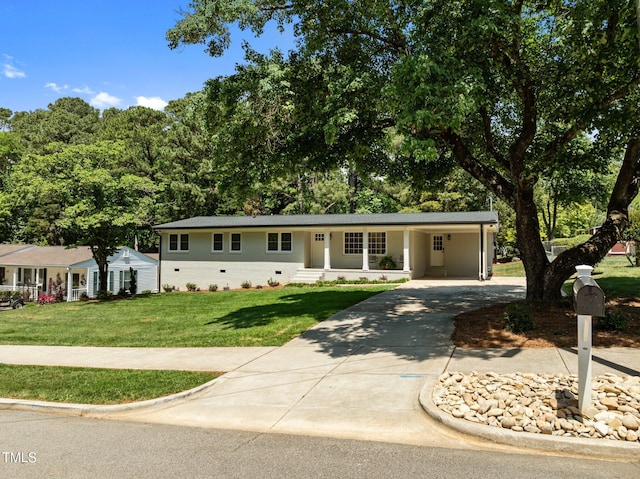 5208 Melbourne Rd, Raleigh, NC 27606 - ranch-style home featuring driveway, a front yard, and an attached carport