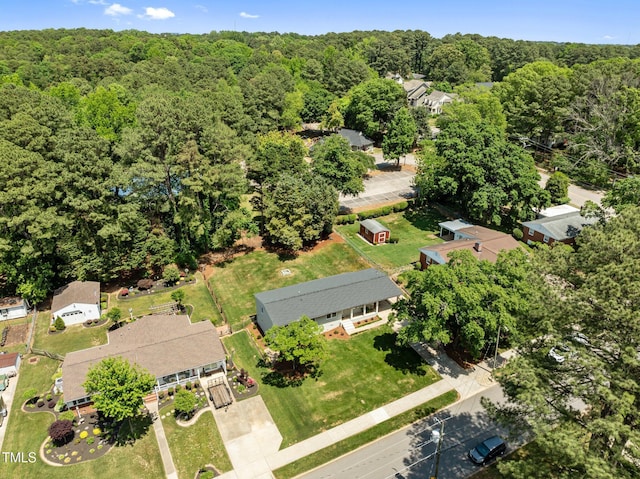 5208 Melbourne Rd, Raleigh, NC 27606 - aerial overview of property's location featuring a heavily wooded area
