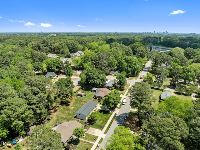 5208 Melbourne Rd, Raleigh, NC 27606 - aerial overview of property's location with a heavily wooded area